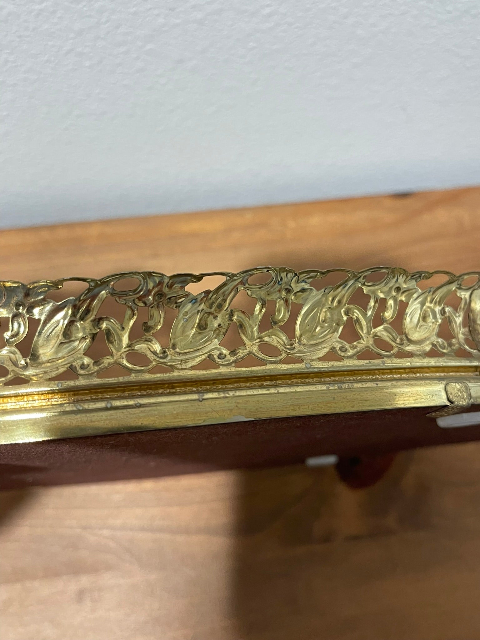 Vintage gold filigree oval mirror vanity tray, angled view showing openwork filigree detail