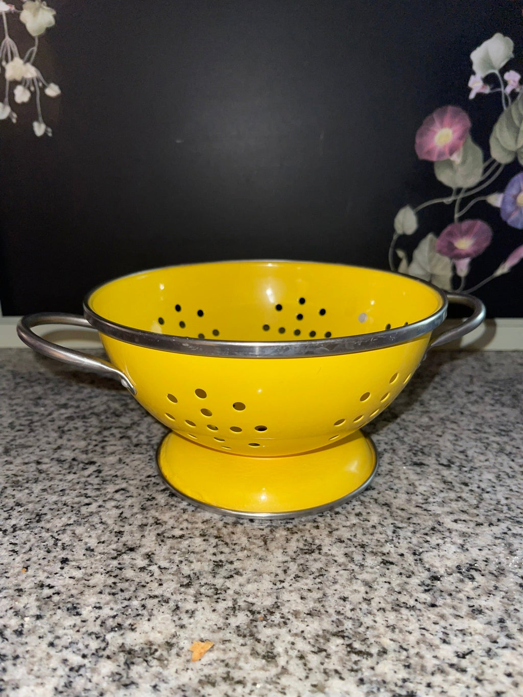 Vintage yellow enamel colander with chrome handles and footed base
