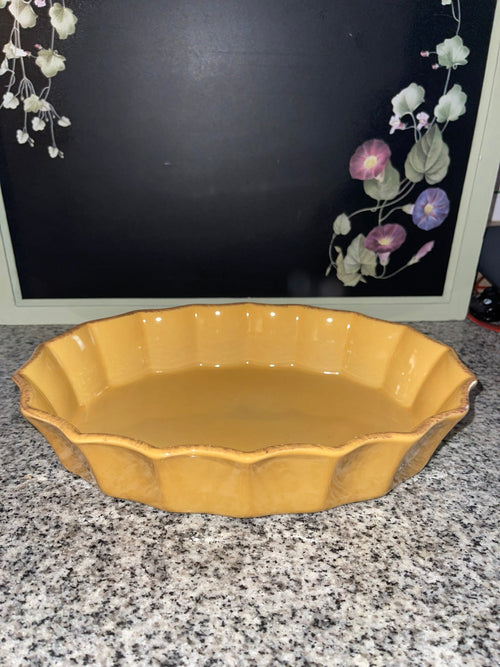 Cerruti stoneware mustard yellow oval baking dish, front view