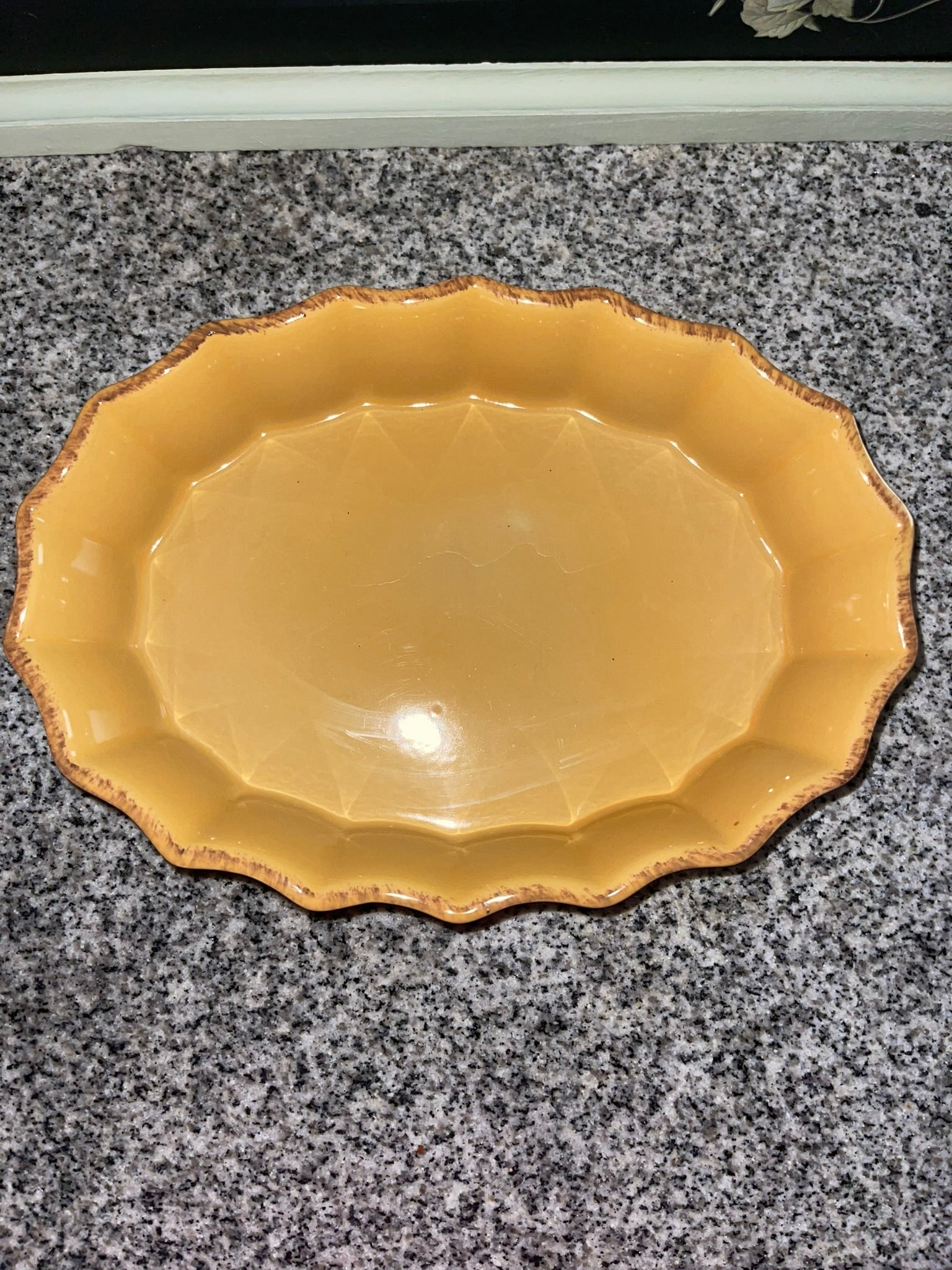 Cerruti stoneware oval platter top view showing scalloped edge