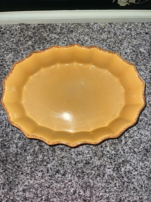 Cerruti stoneware oval platter top view showing scalloped edge