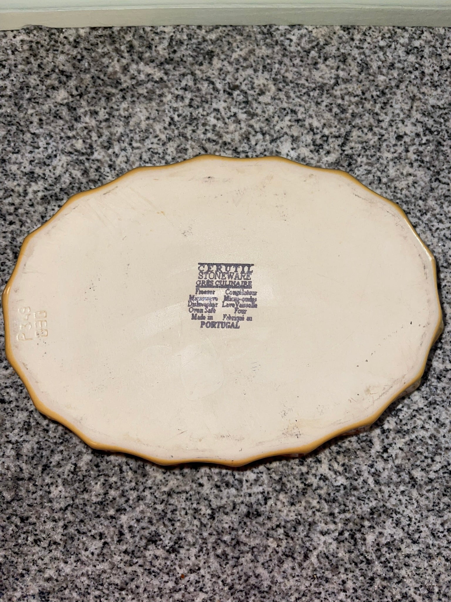 Back of Cerruti stoneware oval platter with maker's mark
