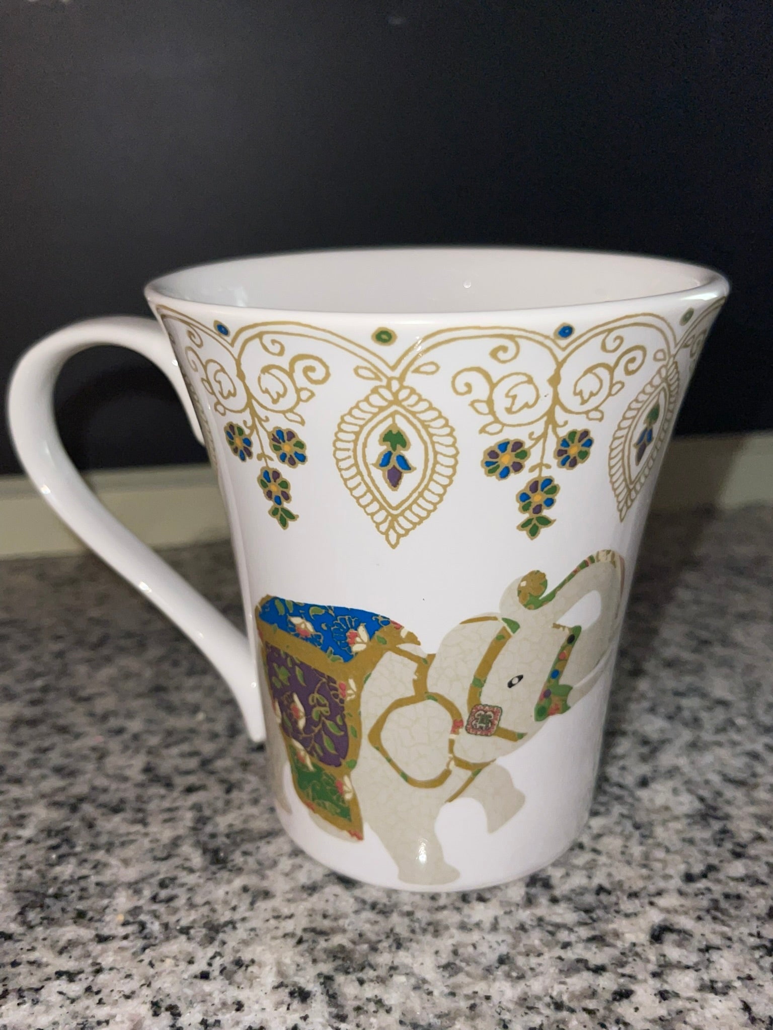 Close-up of Coventry jeweled elephant mug with gold filigree detail
