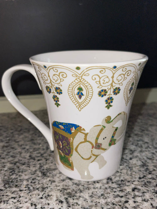 Close-up of Coventry jeweled elephant mug with gold filigree detail