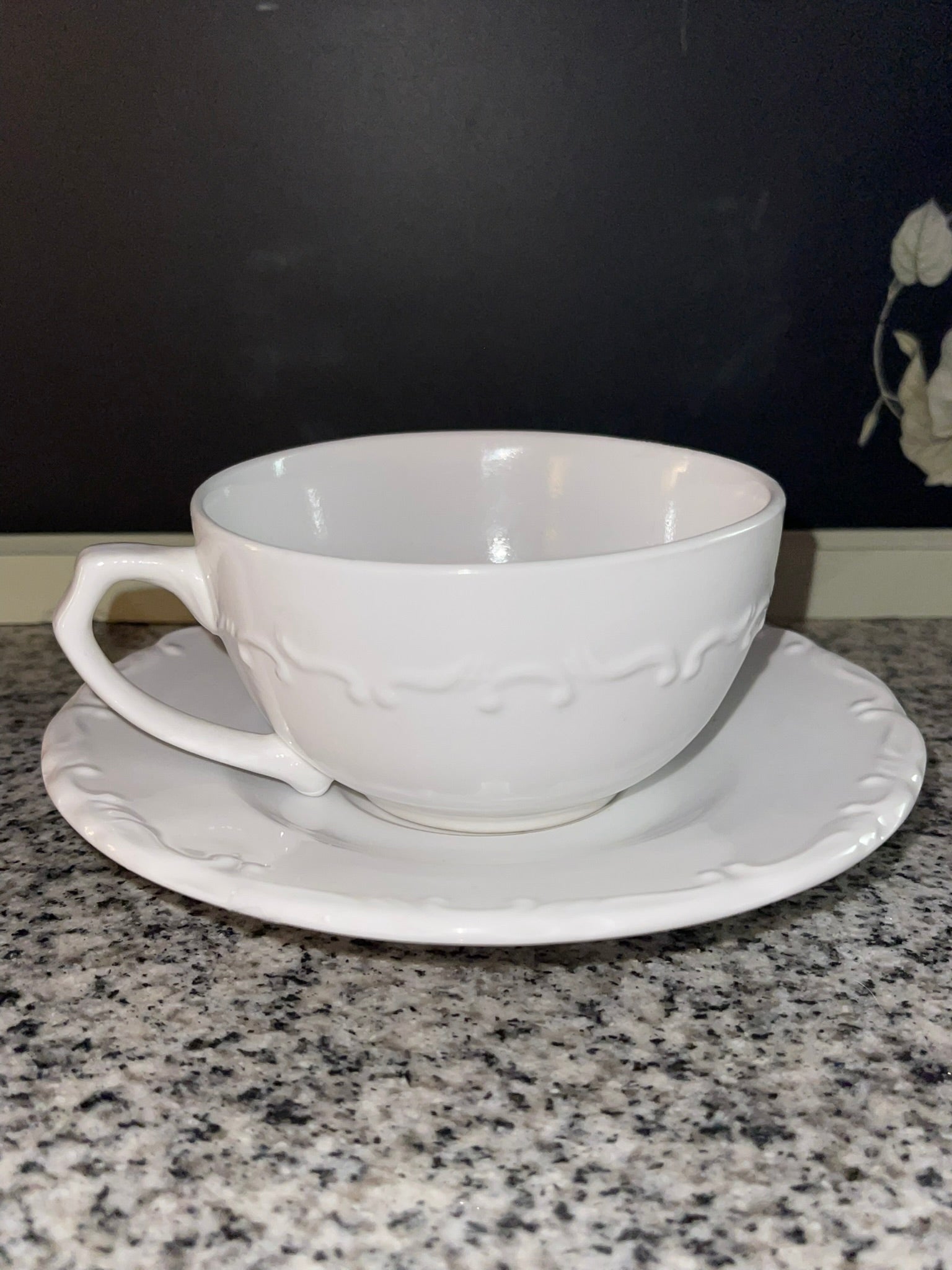 Gibson Everyday white embossed teacup and saucer set, side view