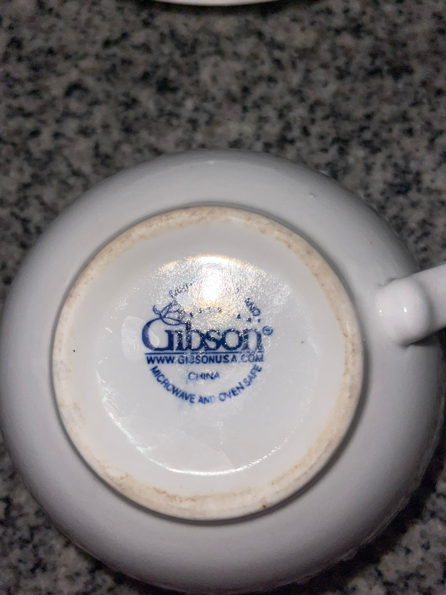 Bottom of Gibson teacup showing Gibson Everyday backstamp, microwave and oven safe