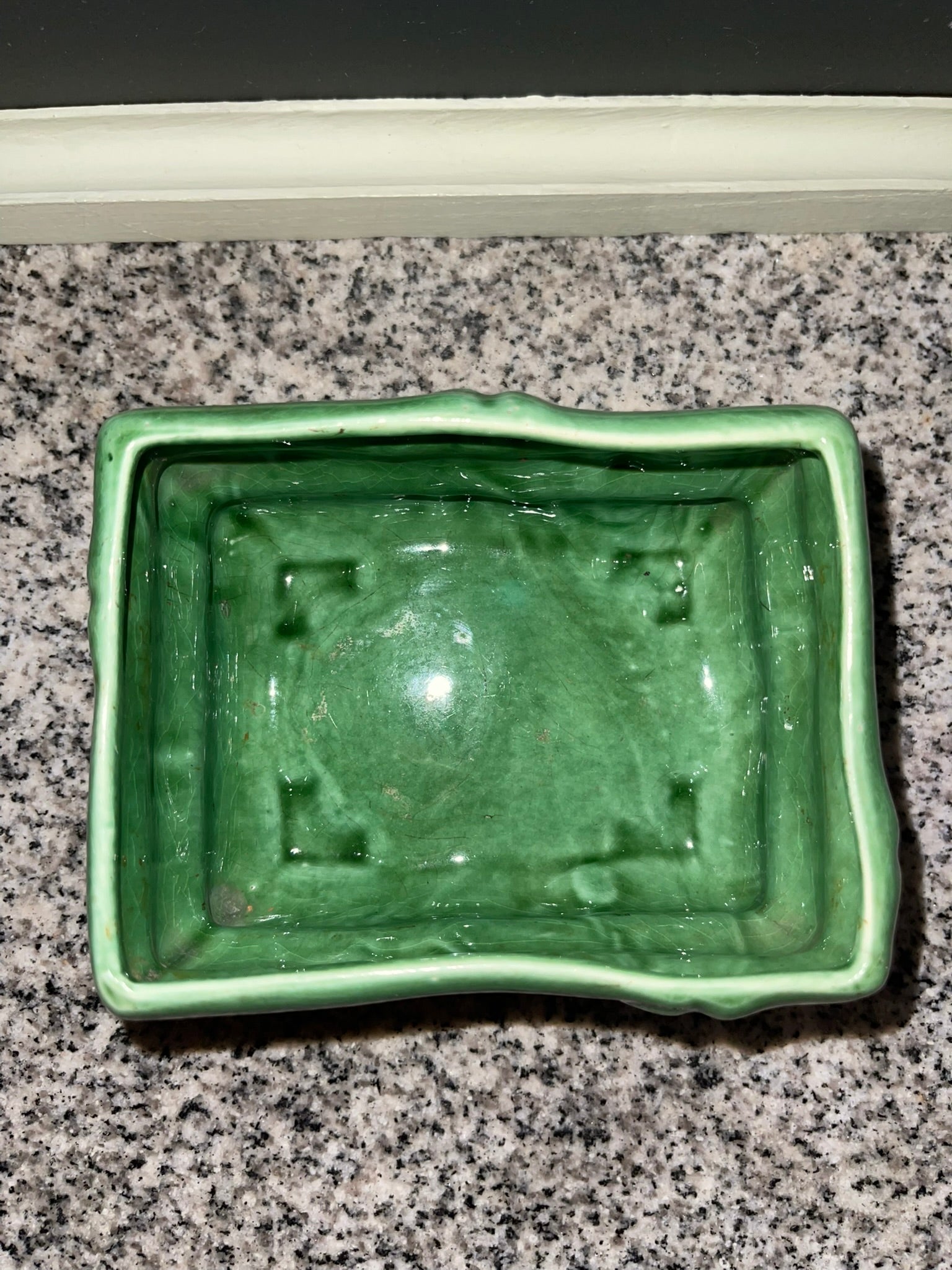 Top-down view of vintage green bamboo planter showing interior and scalloped rim