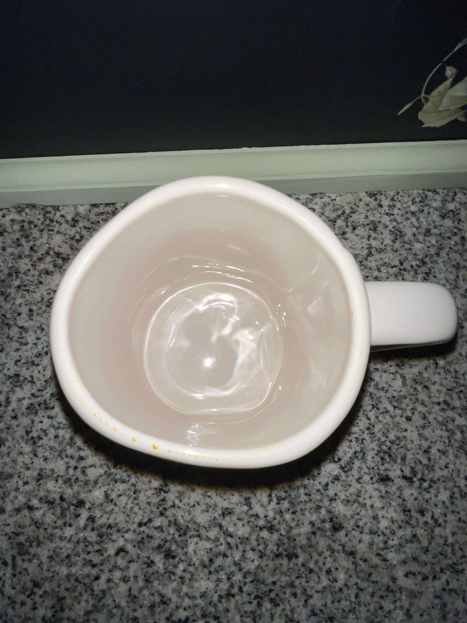 Top-down view of Rae Dunn SWEET PEA mug showing clean white interior