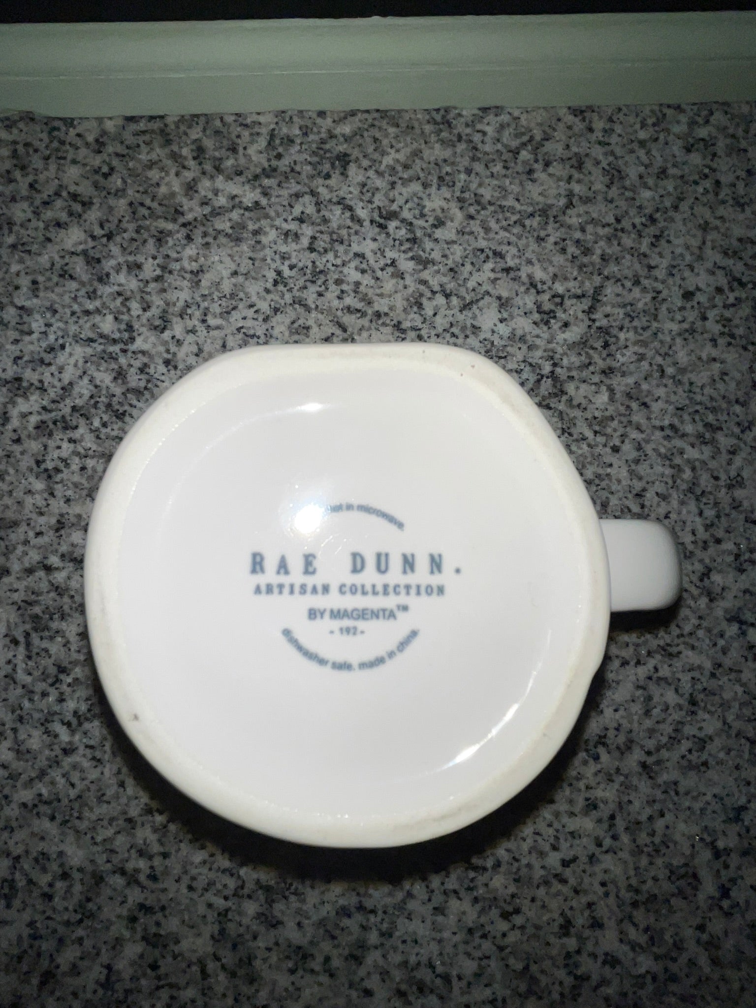 Bottom of Rae Dunn SWEET PEA mug showing Artisan Collection by Magenta backstamp