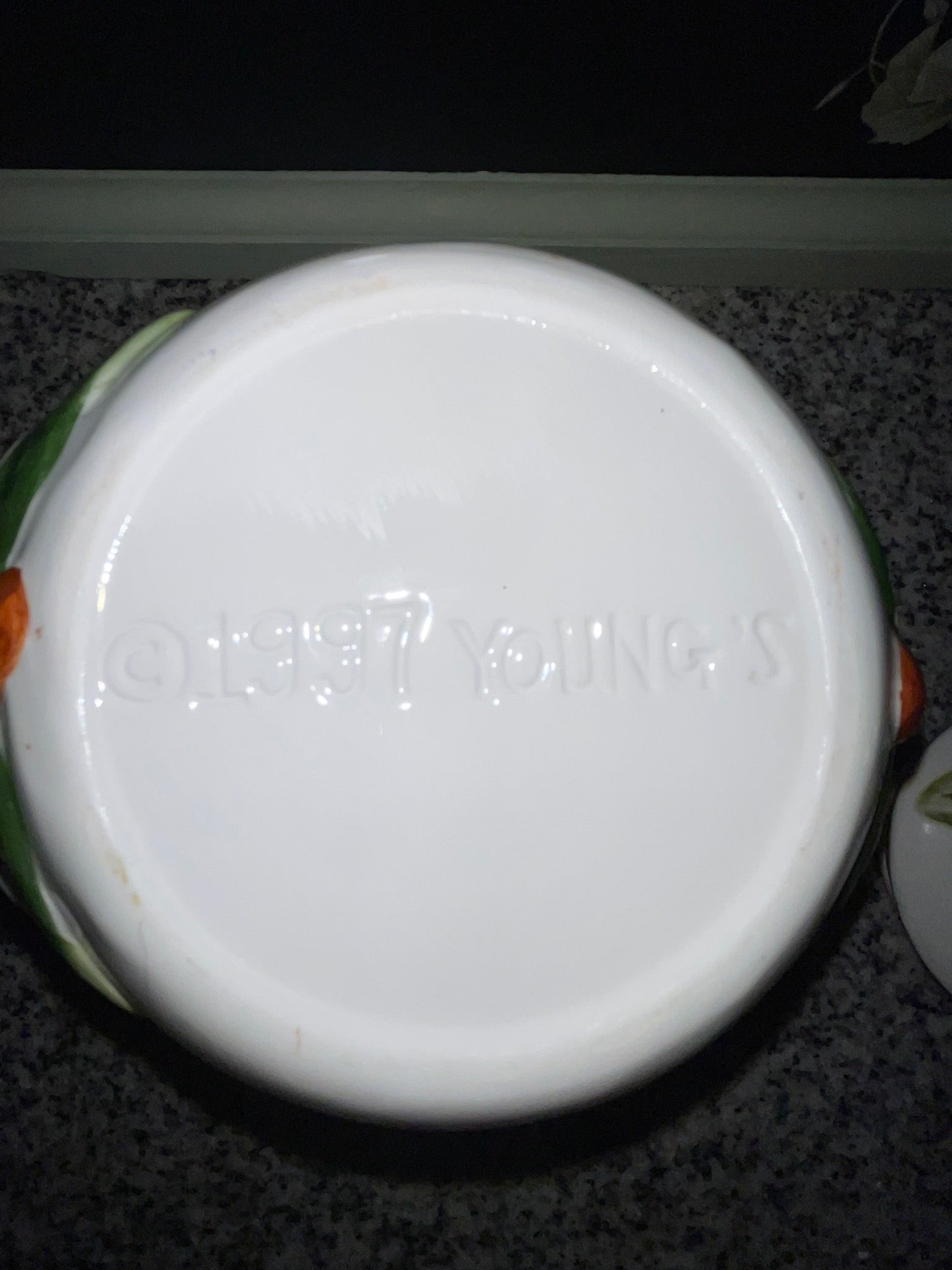Bottom of NINS cookie jar showing embossed copyright 1997 by NINS backstamp