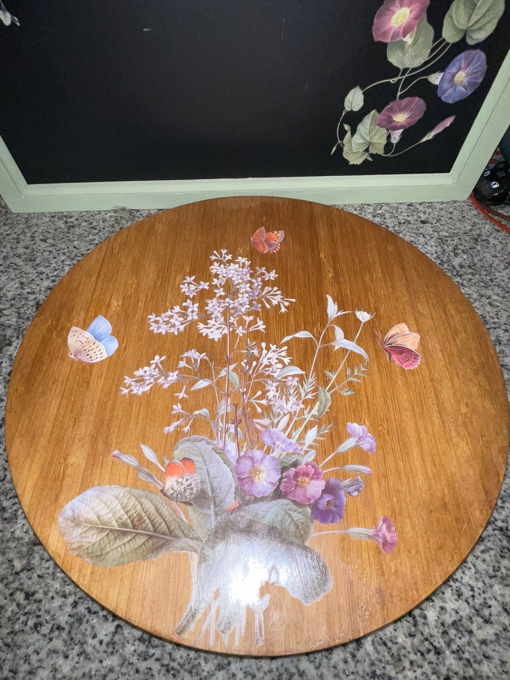 Vintage bamboo lazy Susan angled view showing full botanical decoupage scene