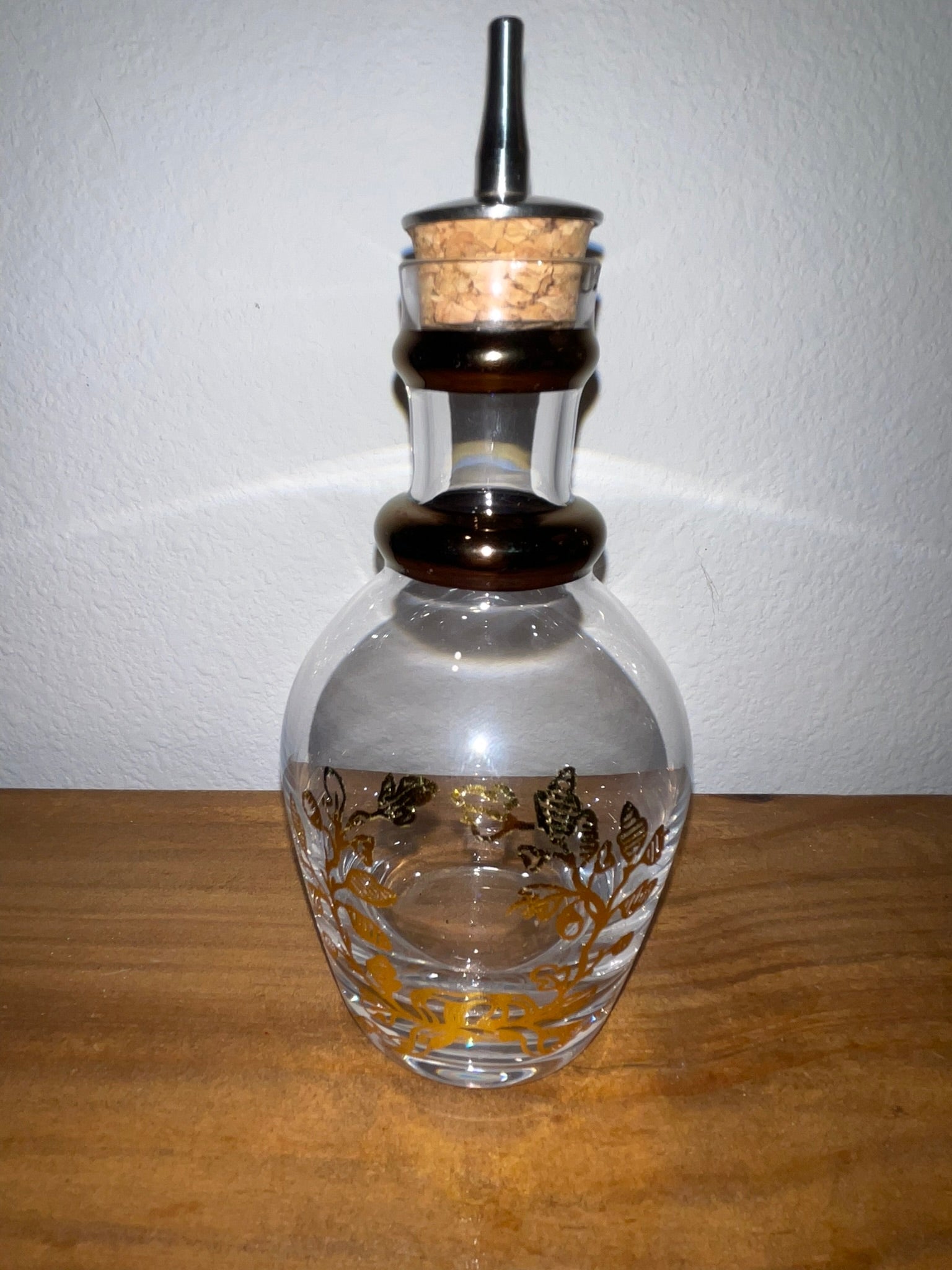 Vintage glass cruet decanter showing gold gilt etched floral motif side