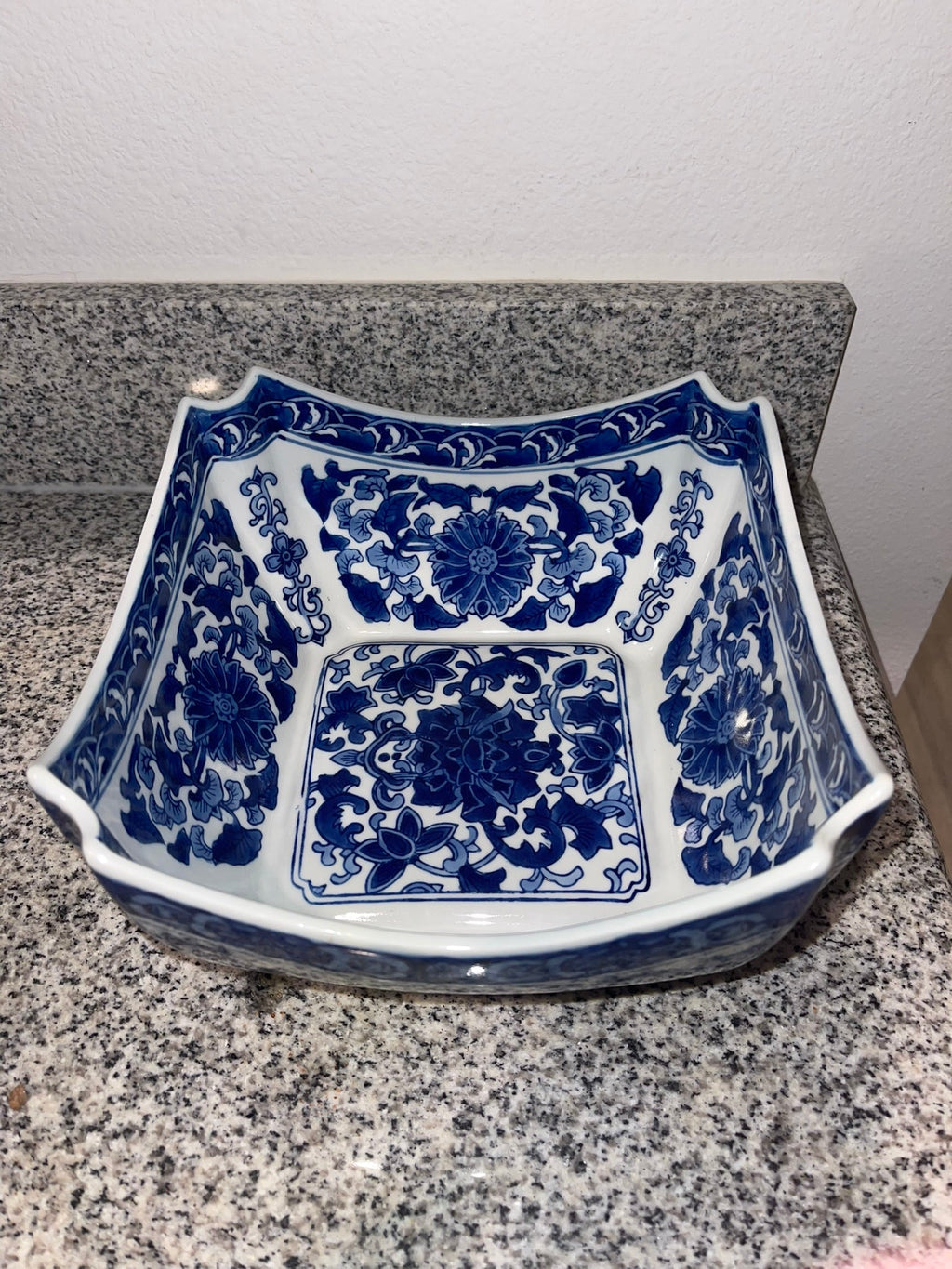 Interior top view of Chinese blue and white square bowl with floral medallion