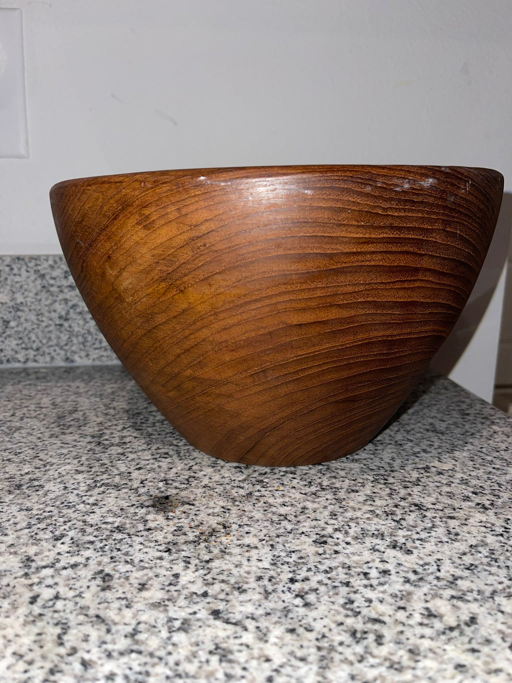 Top view of genuine teak wood bowl showing concentric grain rings